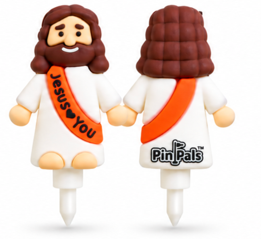Two Jesus-themed Pin Pals toy figures shown front and back on a white background. The front view shows a smiling figure with brown hair and beard, white robe, and an orange sash that reads 'Jesus ♥ You'.